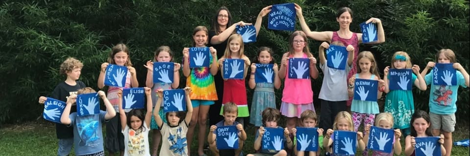 Public support funded program of kids holding cyanotype prints